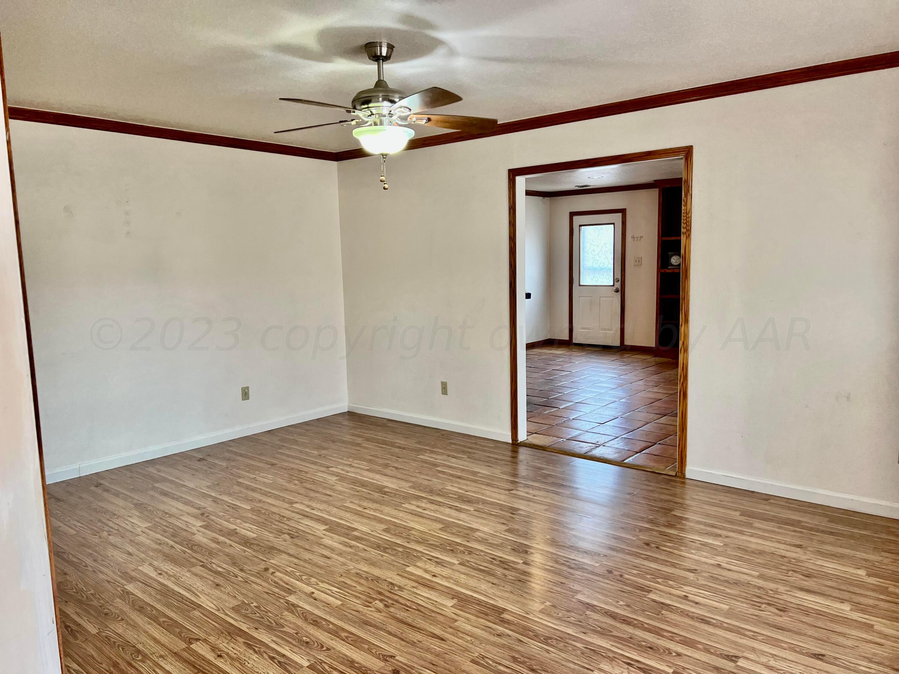 4600 Southwest 38th Avenue Amarillo, TX 79109 - Photo 9 of 19 a view of an empty room with wooden floor
