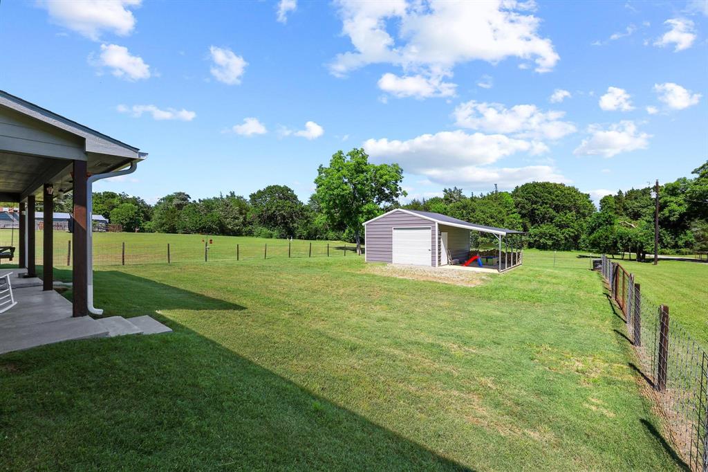 2658 Oak Ridge Road Denison, TX 75021 - Photo 28 of 37 a house view with a garden space