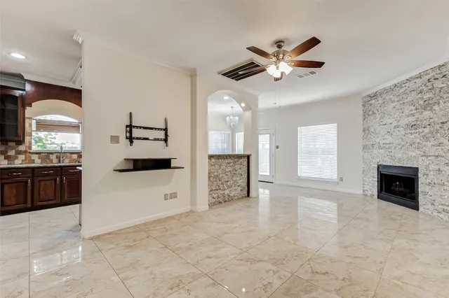 a view of a kitchen with a stove cabinets and a ceiling fan