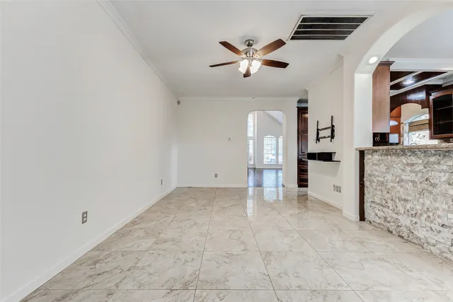 a large kitchen with stainless steel appliances granite countertop a stove and a sink