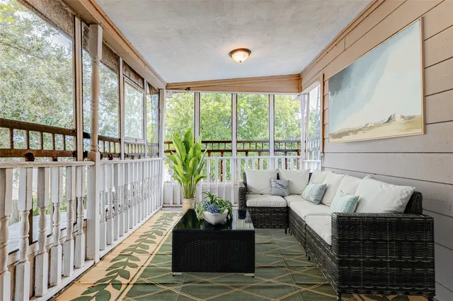 a view of porch with wooden floor