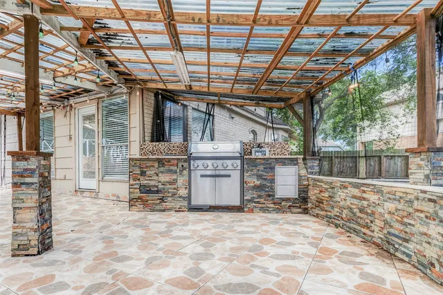 a view of front door with outdoor seating