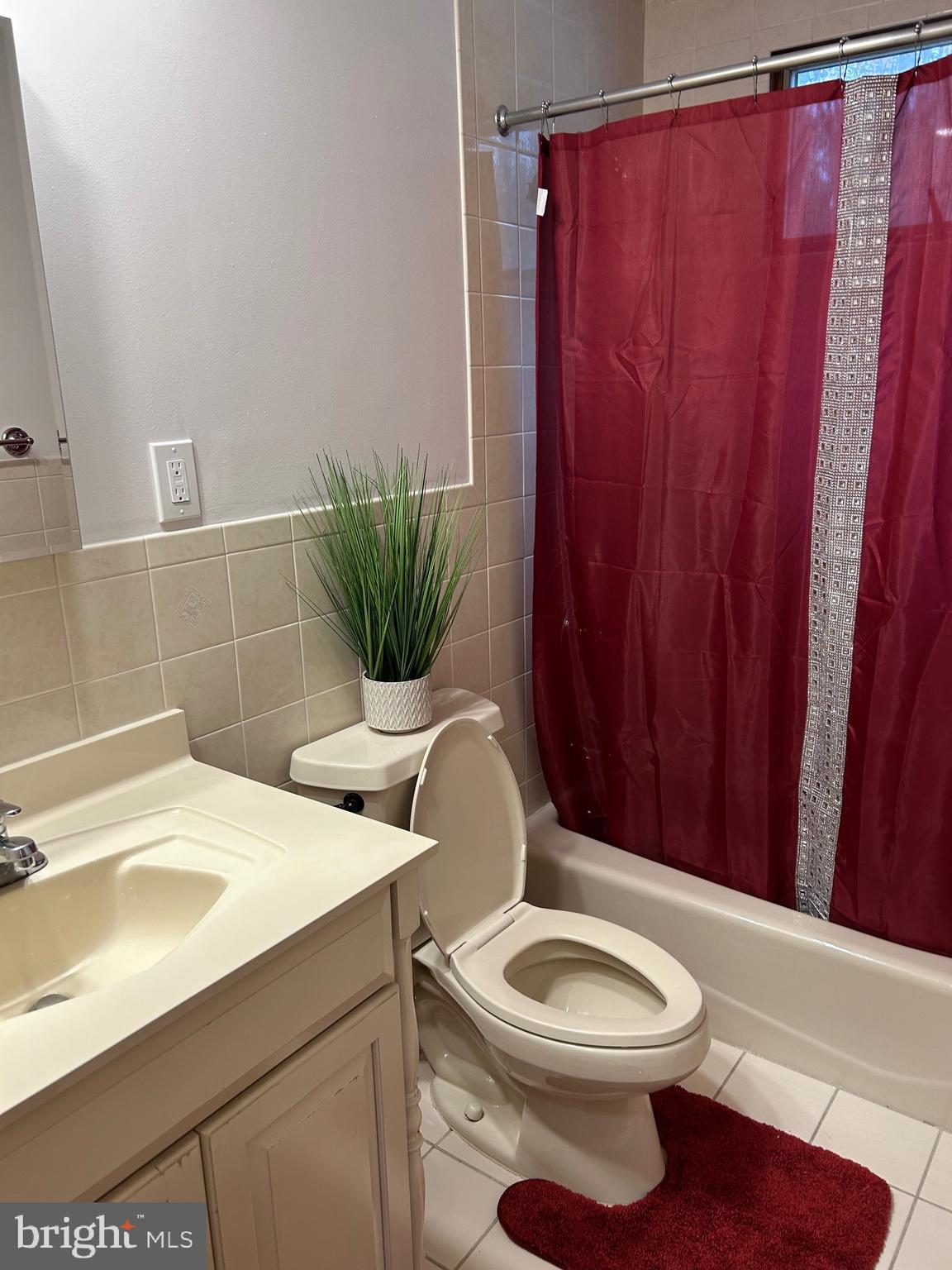 69 Wickom Avenue Hamilton, NJ 08690 - Photo 14 of 14 a bathroom with a toilet a sink and curtain