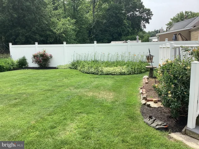 a view of a garden with houses