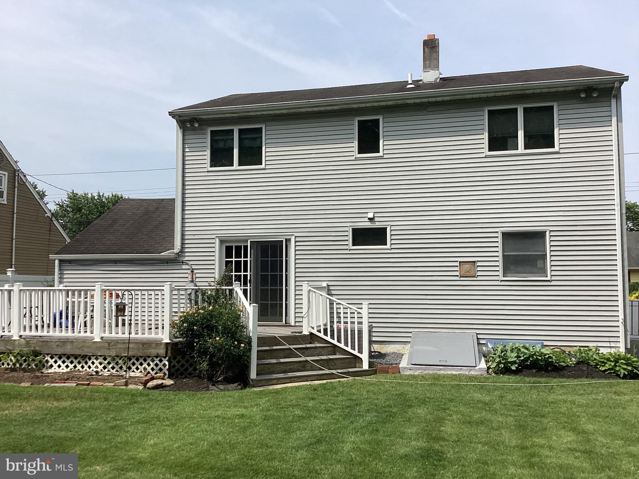 69 Wickom Avenue Hamilton, NJ 08690 - Photo 5 of 14 a front view of a house with a yard