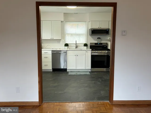 a kitchen with a stove and a refrigerator