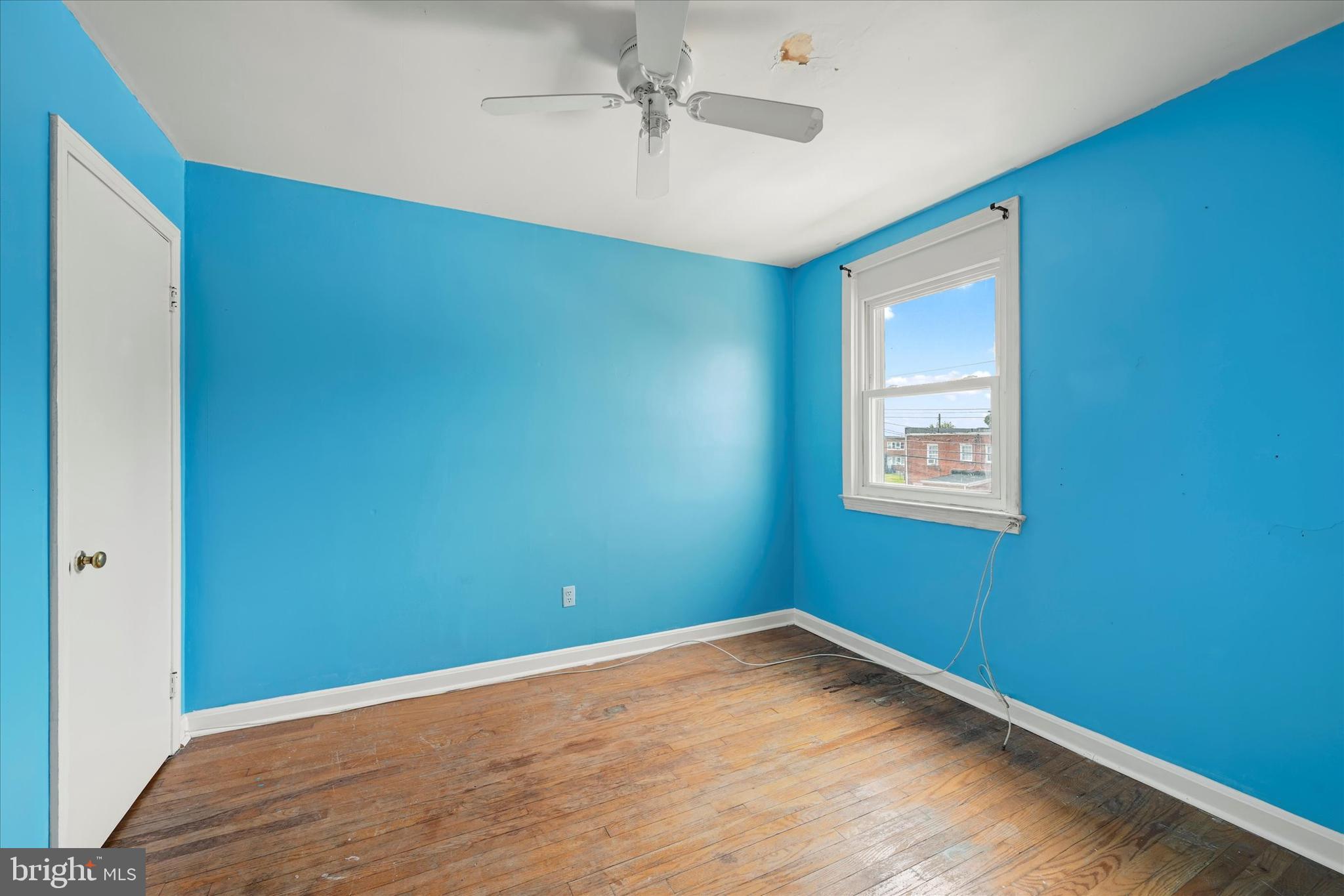 8059 Gray Haven Road Dundalk, MD 21222 - Photo 12 of 19 an empty room with a window and ceiling fan