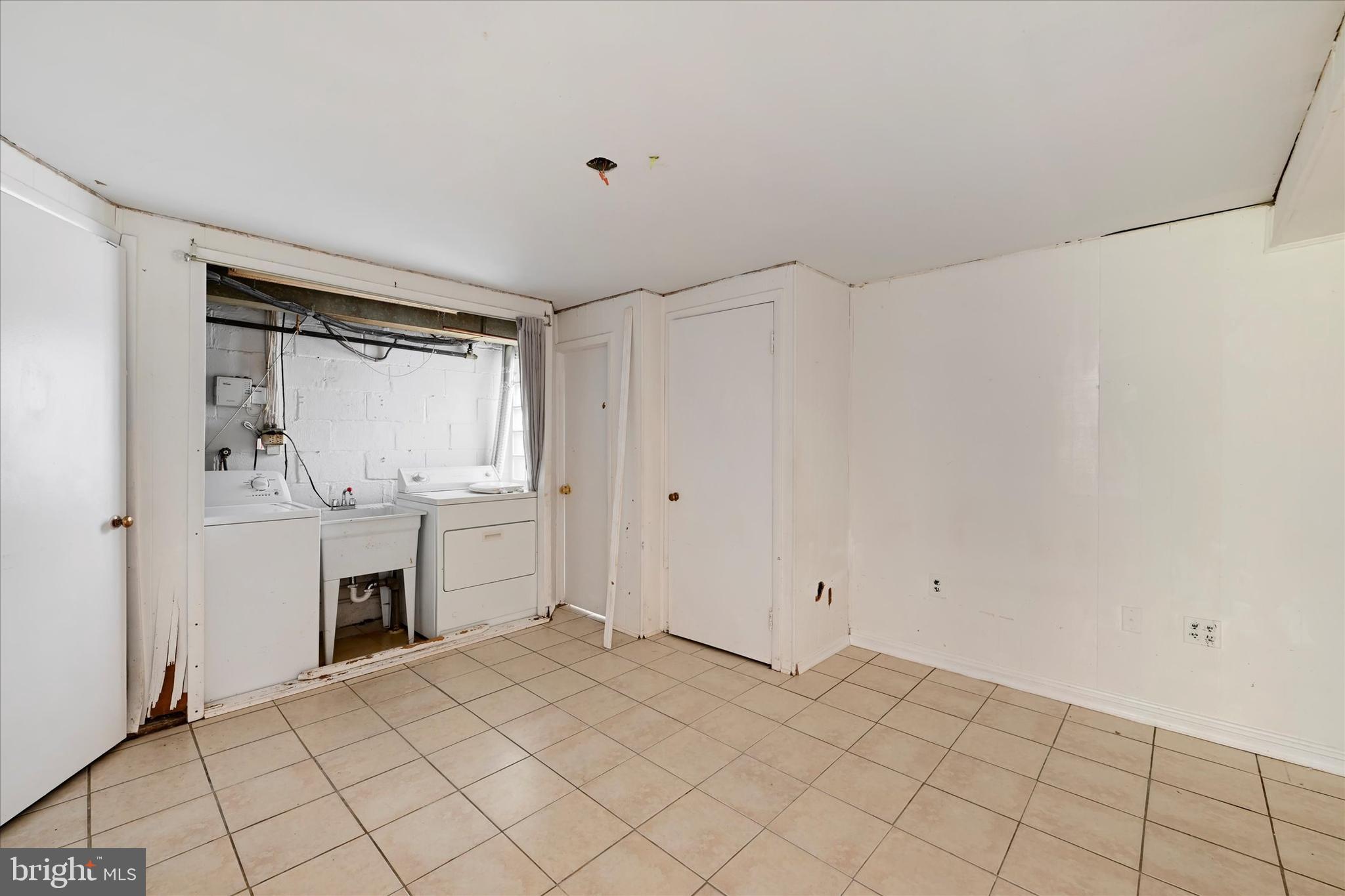 8059 Gray Haven Road Dundalk, MD 21222 - Photo 14 of 19 a room view with a sink and a mirror
