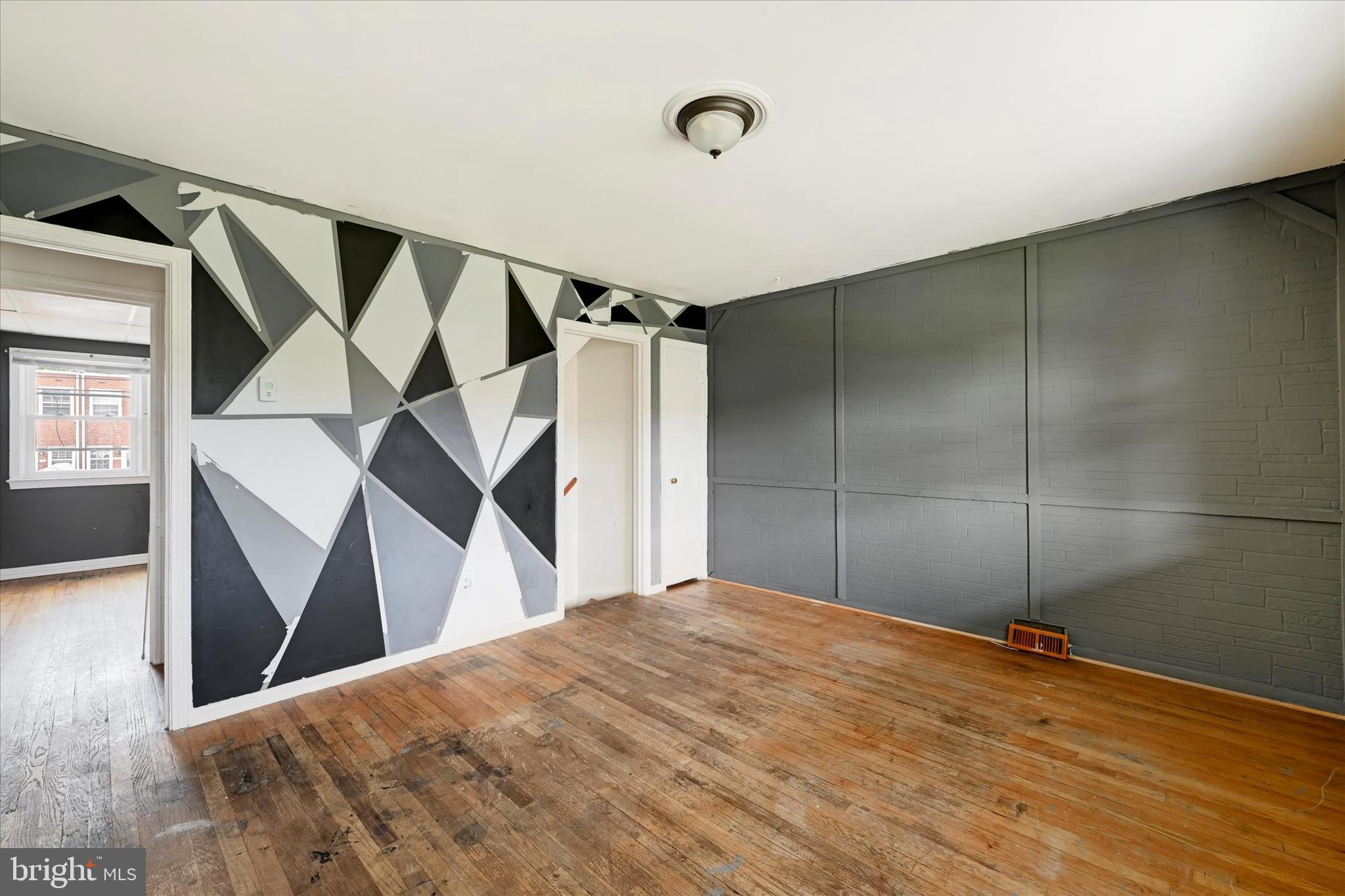8059 Gray Haven Road Dundalk, MD 21222 - Photo 5 of 19 a view of a big room with wooden floor and windows