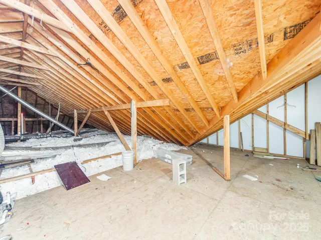 a view of a storage & utility room with cabinets