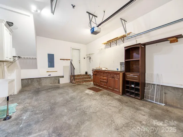 a view of a house with a big yard and potted plants