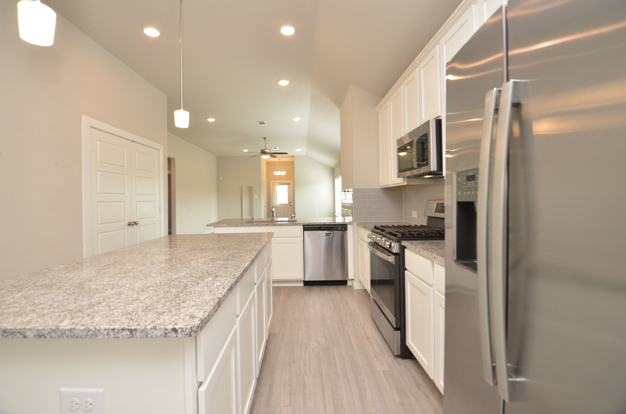 8230 Blue Fish Drive Cypress, TX 77433 - Photo 7 of 18 Large island gives you more counter space. Stainless steel refrigerator included!