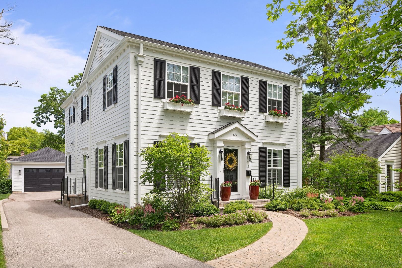 a front view of a house with a yard and porch