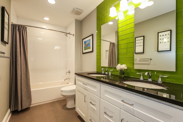 636 Northmoor Road Lake Forest, IL 60045 - Photo 22 of 40 a spacious bathroom with a granite countertop sink mirror vanity bathtub and a toilet