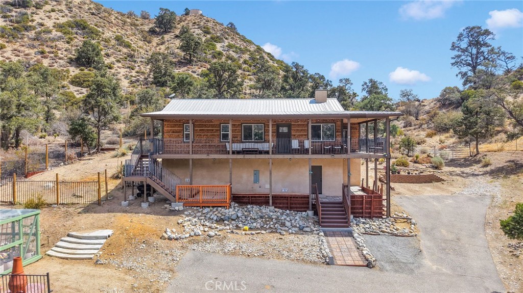 7635 Desert Front Road Wrightwood, CA 92397 - Photo 1 of 60 front view of a house with a small yard