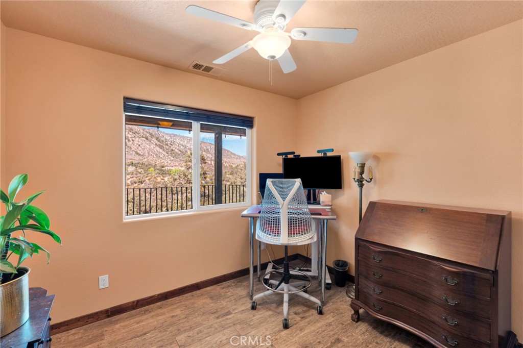 7635 Desert Front Road Wrightwood, CA 92397 - Photo 13 of 60 a workspace with furniture and a window
