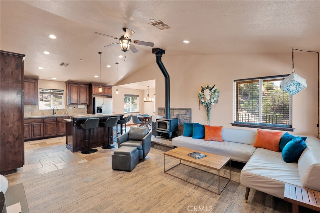 7635 Desert Front Road Wrightwood, CA 92397 - Photo 2 of 60 a living room with lots of furniture and kitchen view