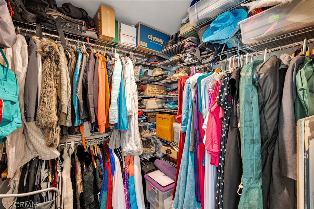 7635 Desert Front Road Wrightwood, CA 92397 - Photo 23 of 60 a view of walk in closet with clothes