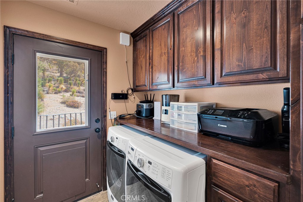 7635 Desert Front Road Wrightwood, CA 92397 - Photo 24 of 60 a kitchen with stainless steel appliances granite countertop a sink stove and cabinets