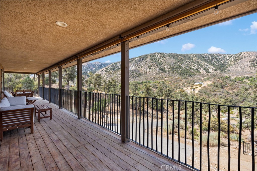 7635 Desert Front Road Wrightwood, CA 92397 - Photo 25 of 60 a view of balcony with wooden floor