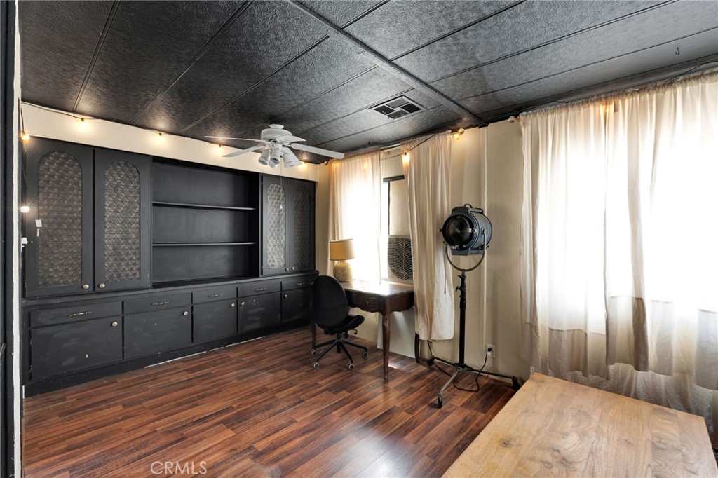 7635 Desert Front Road Wrightwood, CA 92397 - Photo 32 of 60 a view of a room with wooden floor and windows