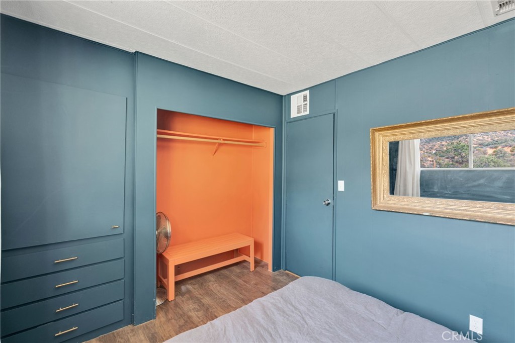 7635 Desert Front Road Wrightwood, CA 92397 - Photo 37 of 60 a bedroom with a bed and a window