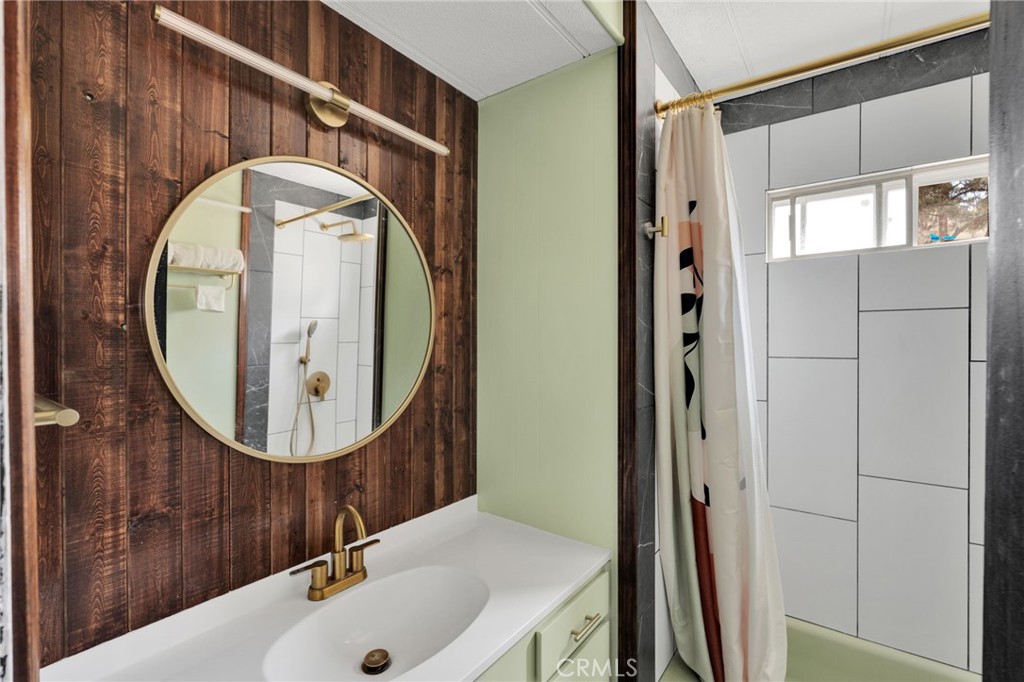 7635 Desert Front Road Wrightwood, CA 92397 - Photo 38 of 60 a bathroom with a sink and a mirror