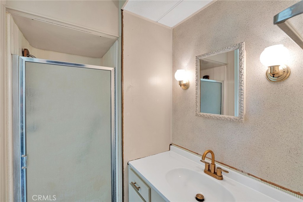 7635 Desert Front Road Wrightwood, CA 92397 - Photo 43 of 60 a bathroom with a sink and mirror