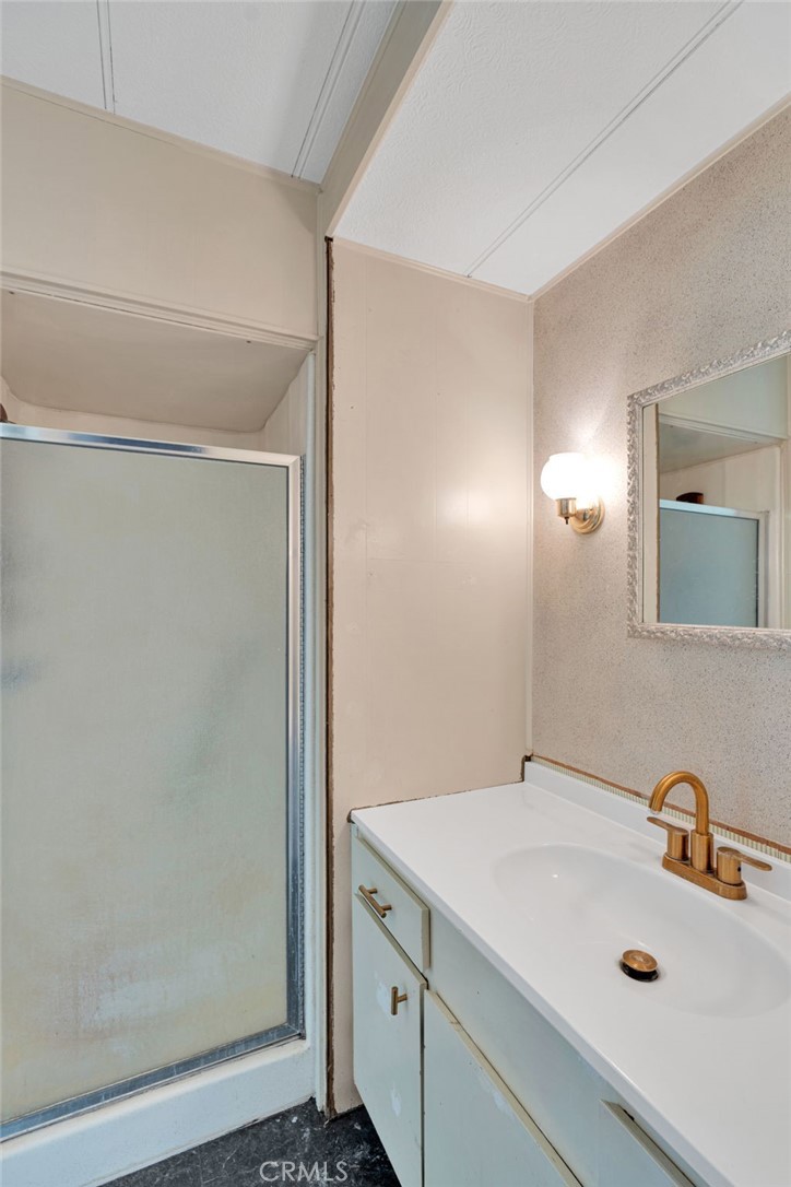 7635 Desert Front Road Wrightwood, CA 92397 - Photo 44 of 60 a bathroom with a sink and a mirror