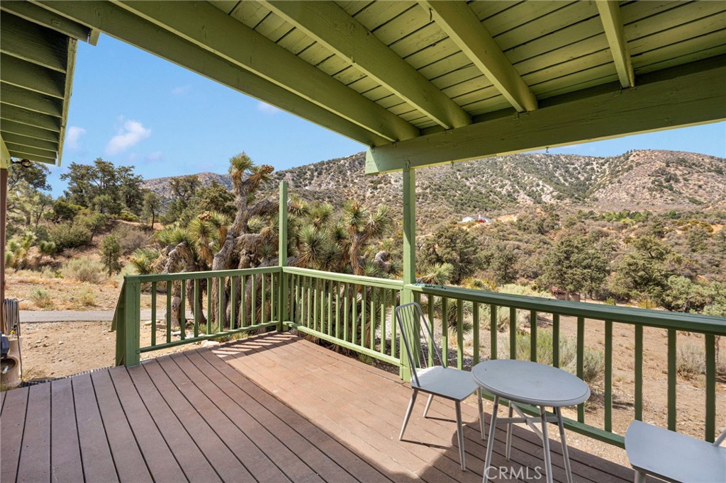7635 Desert Front Road Wrightwood, CA 92397 - Photo 46 of 60 a view of a balcony with wooden floor
