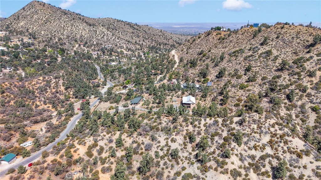 7635 Desert Front Road Wrightwood, CA 92397 - Photo 54 of 60 a view of a large building with a mountain in the background