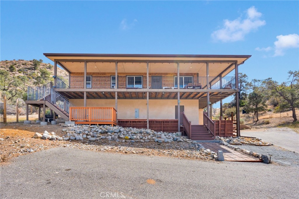 7635 Desert Front Road Wrightwood, CA 92397 - Photo 59 of 60 a view of a house with a yard