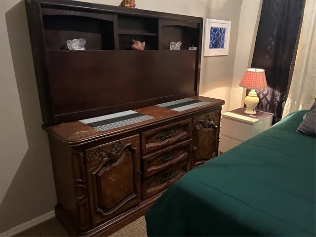 a stove top oven sitting inside of a kitchen