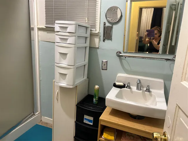 a kitchen with stainless steel appliances granite countertop a sink and a microwave