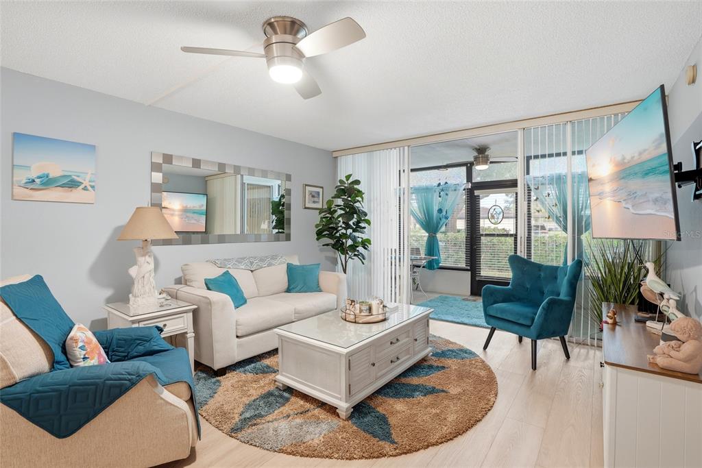 12300 Vonn Road, Unit 7104 Largo, FL 33774 - Photo 11 of 41 a living room with furniture and a large window