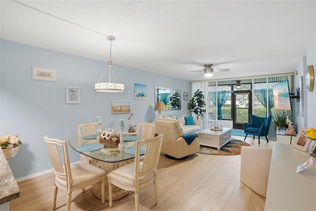12300 Vonn Road, Unit 7104 Largo, FL 33774 - Photo 15 of 41 a living room with furniture dining table and a large window