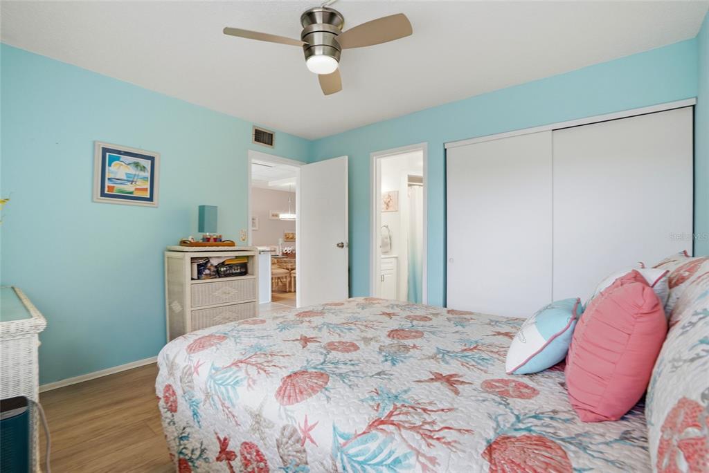 12300 Vonn Road, Unit 7104 Largo, FL 33774 - Photo 29 of 41 a bedroom with a bed and a television