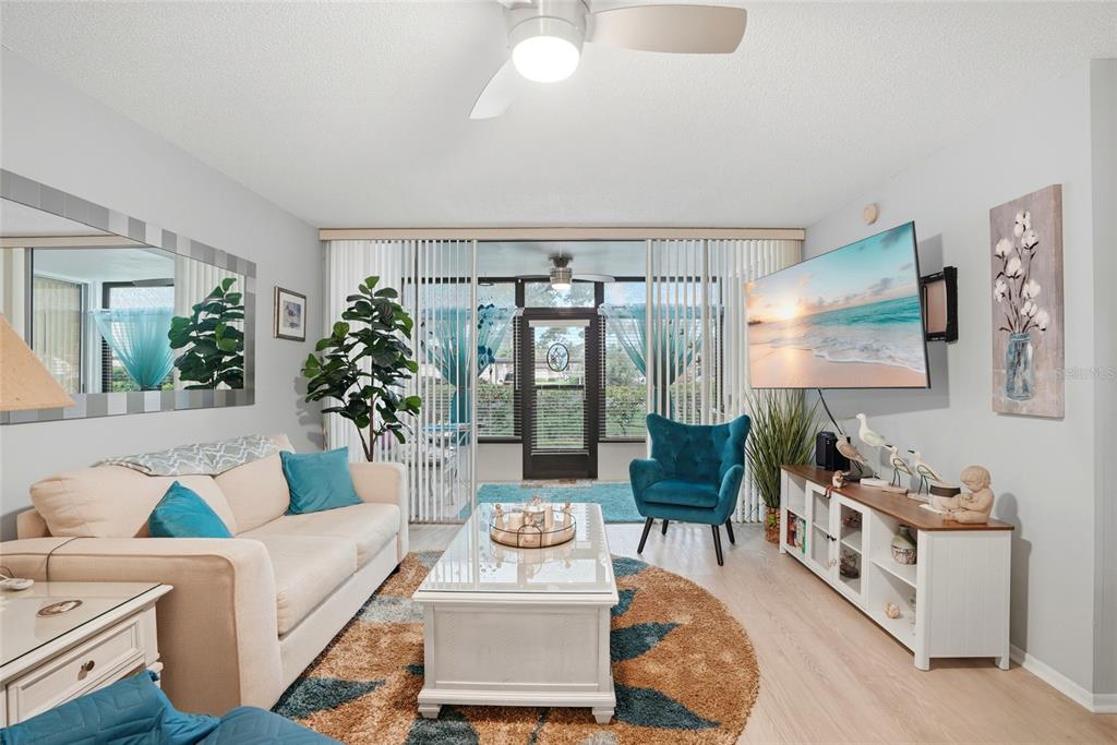 12300 Vonn Road, Unit 7104 Largo, FL 33774 - Photo 10 of 41 a living room with furniture and a large window