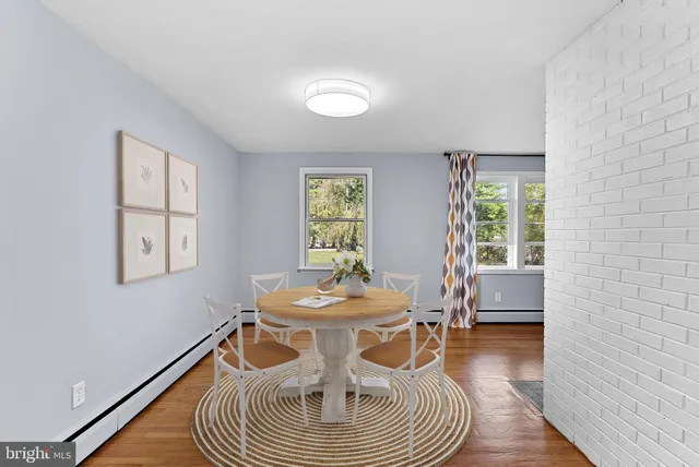 a kitchen with a sink a stove a microwave and cabinets