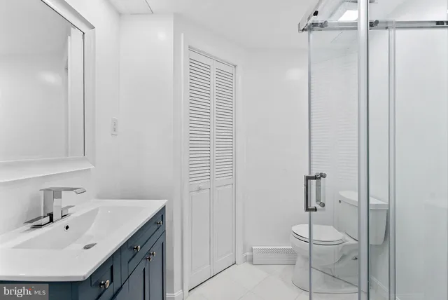 a bathroom with a shower and a toilet