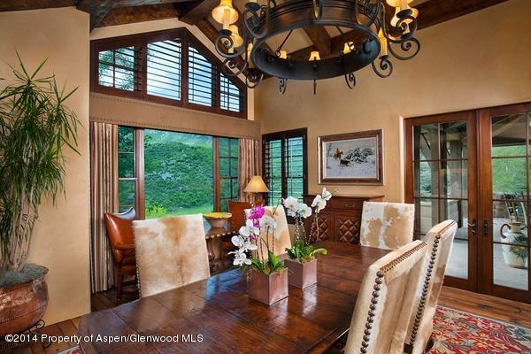 770 Pioneer Springs Ranch Road Aspen, CO 81611 - Photo 12 of 46 a living room with furniture and a floor to ceiling window