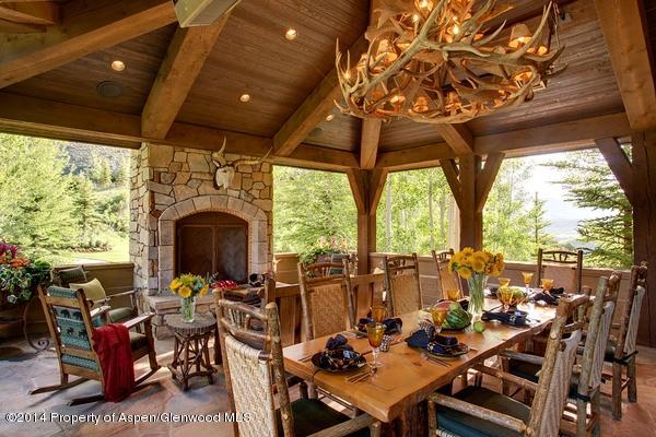 770 Pioneer Springs Ranch Road Aspen, CO 81611 - Photo 15 of 46 a view of a tables and chairs in patio