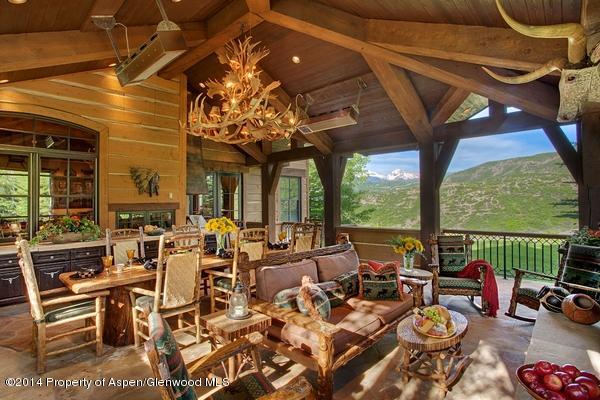 770 Pioneer Springs Ranch Road Aspen, CO 81611 - Photo 16 of 46 a living room with patio furniture and a floor to ceiling window