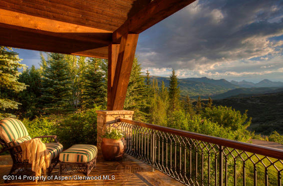 770 Pioneer Springs Ranch Road Aspen, CO 81611 - Photo 20 of 46 a view of a balcony with couches and wooden floor