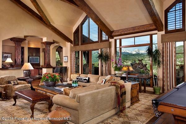 770 Pioneer Springs Ranch Road Aspen, CO 81611 - Photo 2 of 46 a living room with furniture fireplace and large windows