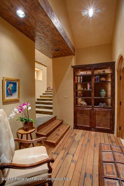 770 Pioneer Springs Ranch Road Aspen, CO 81611 - Photo 24 of 46 a room with wooden floor and furniture