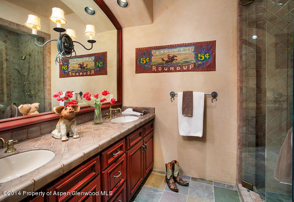 770 Pioneer Springs Ranch Road Aspen, CO 81611 - Photo 26 of 46 a bathroom with double vanity sinks a shower and a mirror