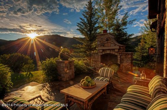 770 Pioneer Springs Ranch Road Aspen, CO 81611 - Photo 29 of 46 a backyard of a house with table and chairs