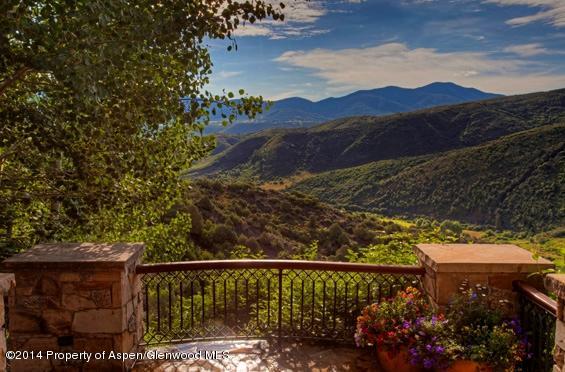770 Pioneer Springs Ranch Road Aspen, CO 81611 - Photo 35 of 46 a view of a street with a flower garden