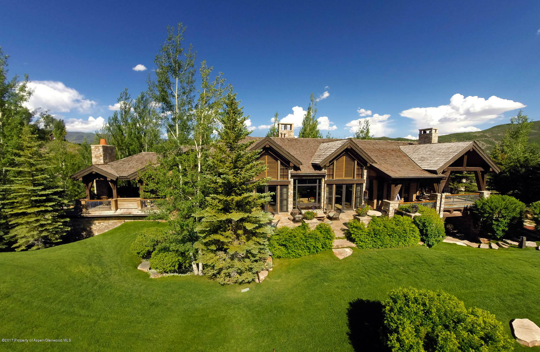 770 Pioneer Springs Ranch Road Aspen, CO 81611 - Photo 44 of 46 a aerial view of a house with swimming pool garden and patio